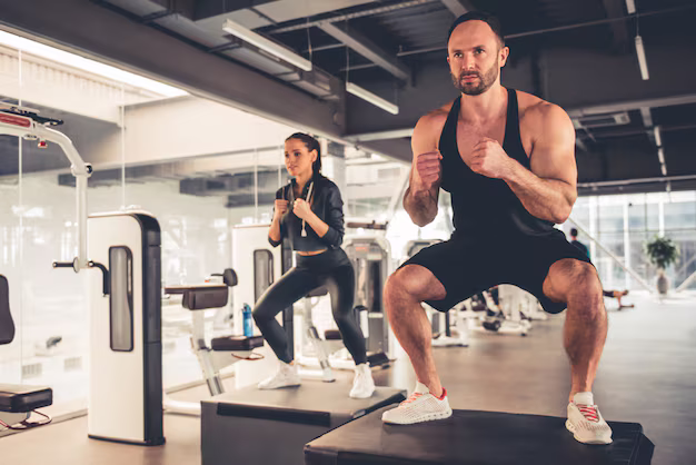 Sports people are doing box jumps while working out gym 85574 7552